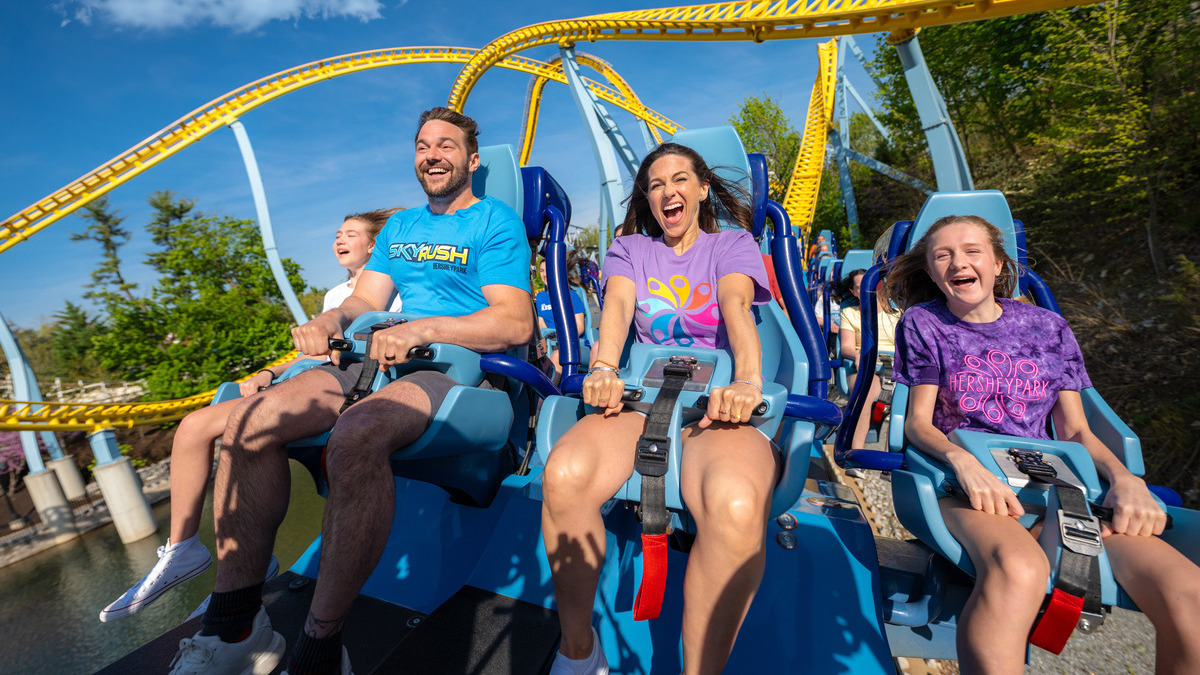 Girls riding skyrush roller coaster