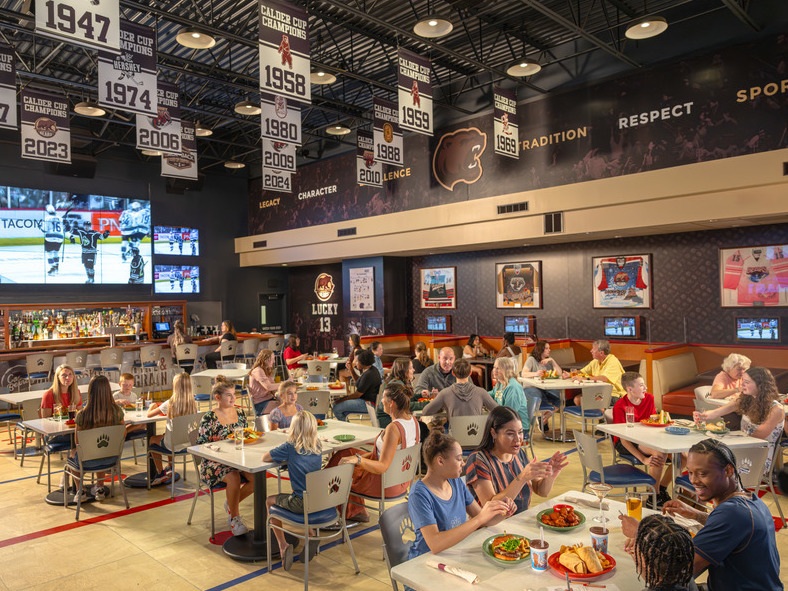 People eating a meal at The Bears' Den