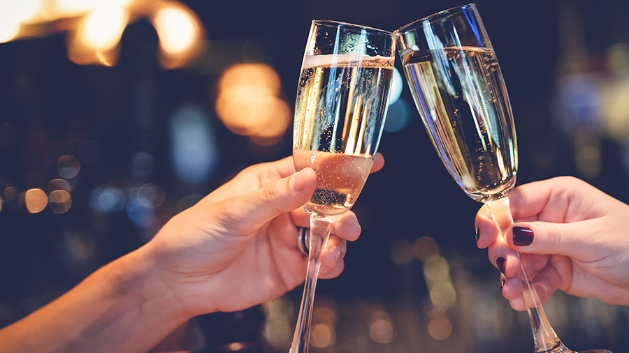 Glasses of wine toast at Hershey Inn & Suites